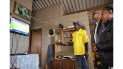 Deputy Minister Kenny Morolong handing over a DDT Set-top box to a Recipient in  Pietermaritzburg, KZN